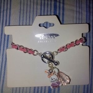 Pink Bracelet with Bunny 🐰 Charm and an extra little cute charm added.